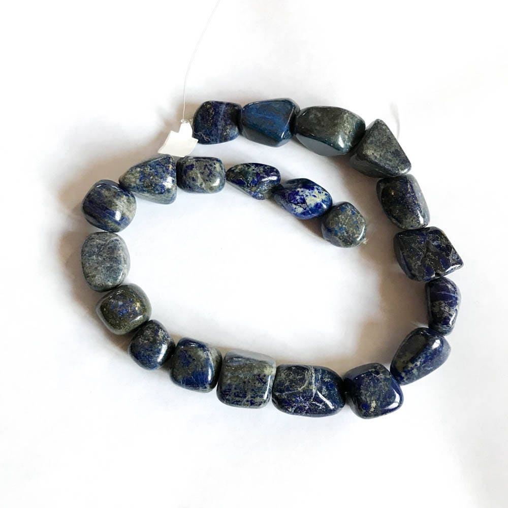 Lapis lazuli Tumble plain 15x18-24x18,unusual Patterns on it . Blue ,16 inch strand,blue color,100% Natural , best Color,Most creative, GEM.