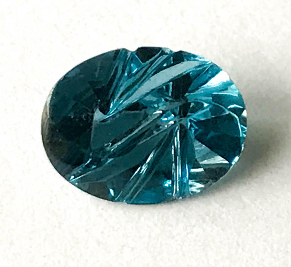 London Blue Topaz Carved  Oval Faceted 7x9 mm, Nice color ,Calibrated,One of a kind