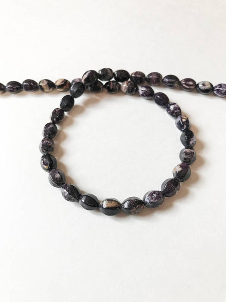 Natural Sugilite  Oval/ barel Faceted 7x9 mm,  with white Natural Patterns,16inch strand,Purple, best Color,Most creative,100% Natural(#920)