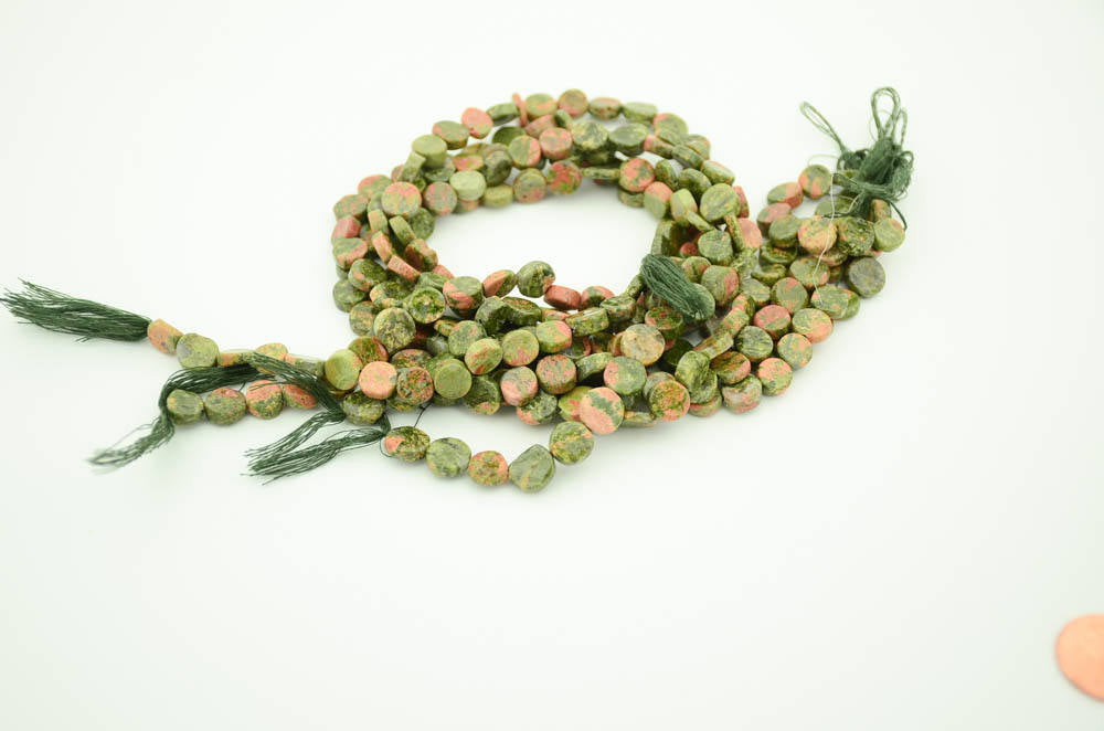 Unikite  Coin plain, 9 mm AAA quality 15 inch full strand.One of a kind,100% natural Earth mined.