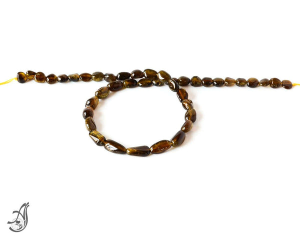 Tourmaline Petro Plain Tumble 6 to 8 mmAAA quality 16 inch full strand.One of a kind,100% natural Earth mined.