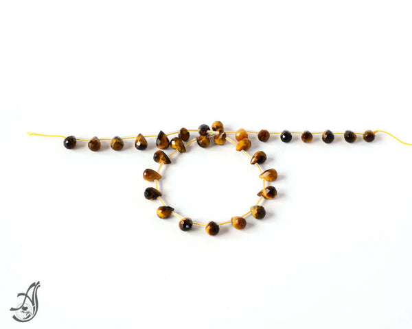 Tigers Eye Briolett Faceted8x1214 inch full strand.One of a kind, very creative..