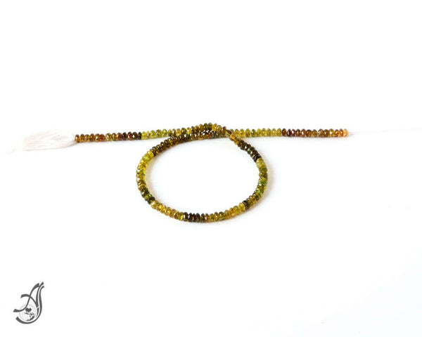 Tourmaline Petro Faceted 5mm Roundale  Greenish AAA quality 14 inch full strand.One of a kind, Multi color.