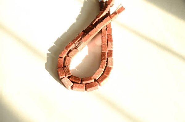 AAA Gold stone AAA Rectangular 8.2x16.7 mm appx. Unusal , one of a kind Brown, Shiny like stars in the light